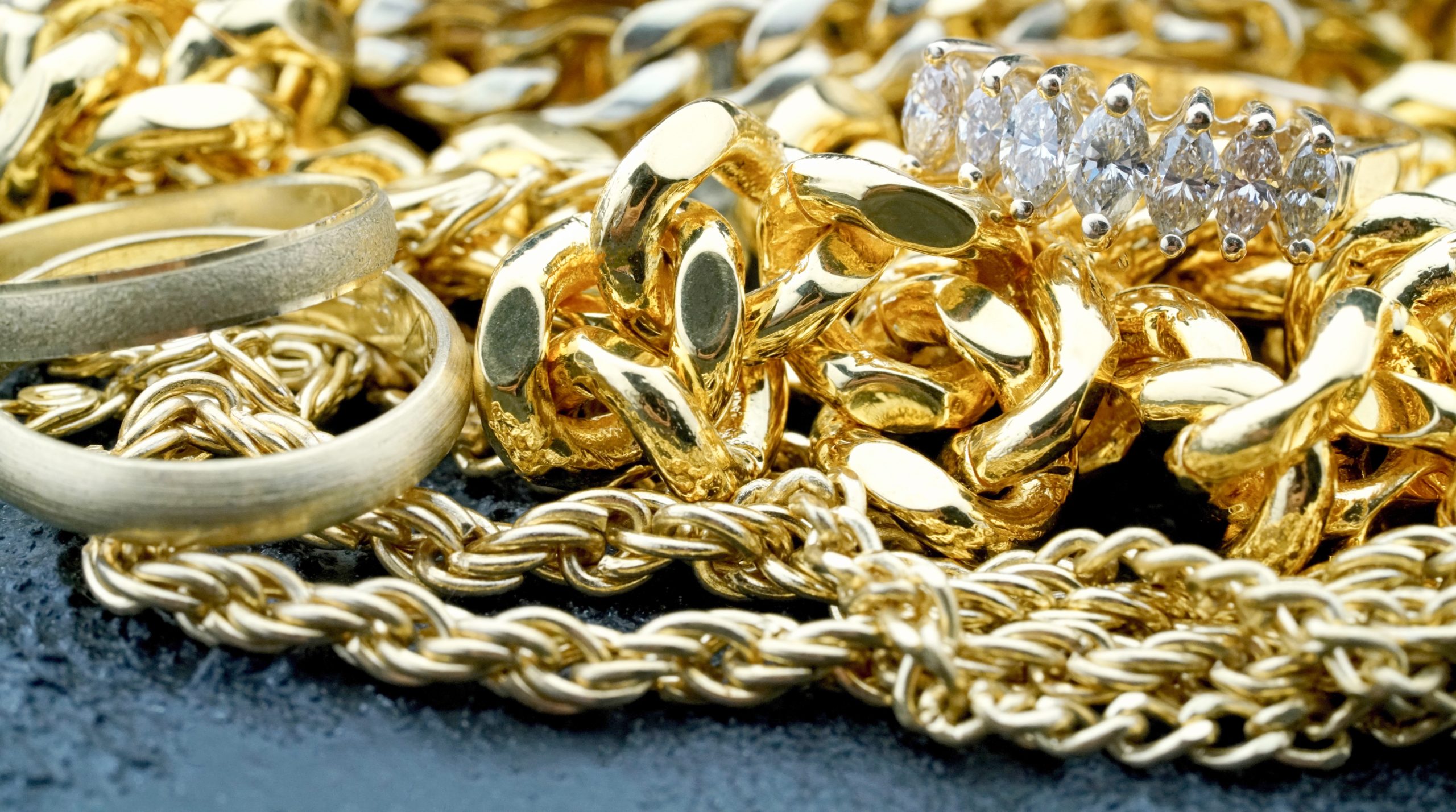 A Pile Of Gold Jewelry