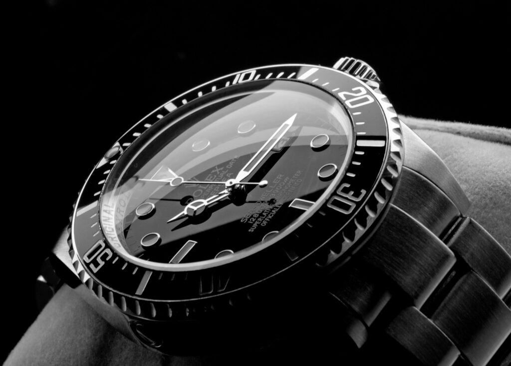 Close-up of a stainless-steel wristwatch with a black dial